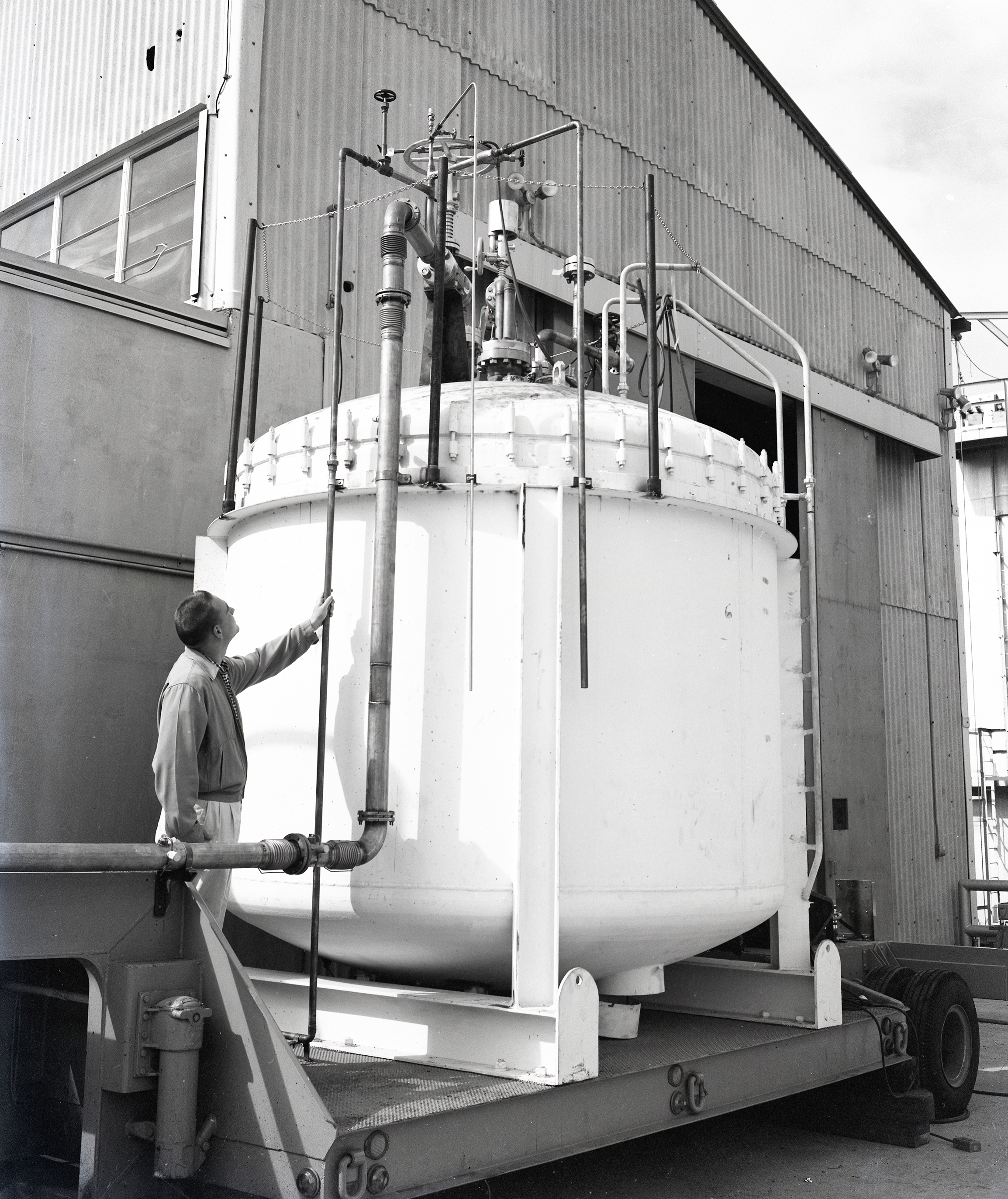 Man looking at tank