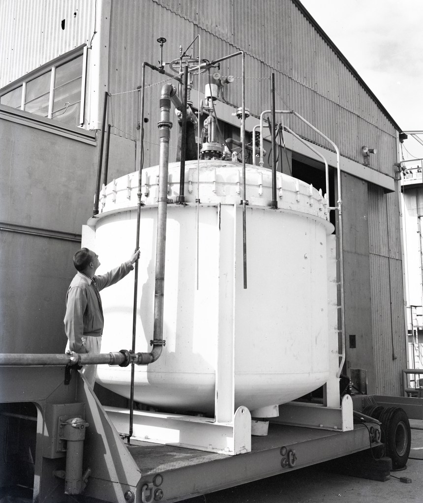 Man looking at tank