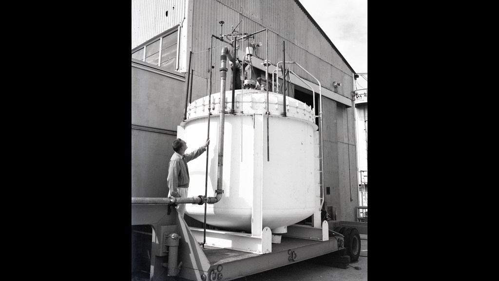 Man looking at tank