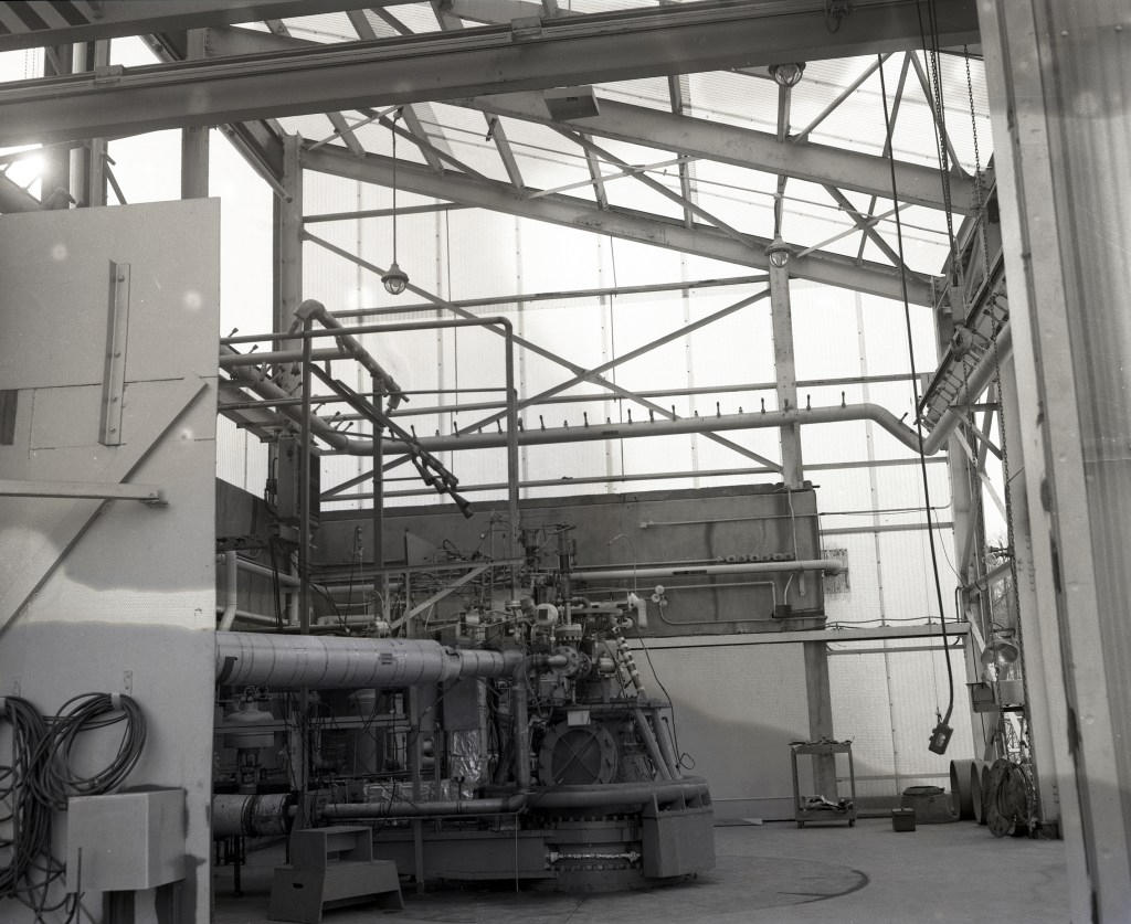 Man with engine in test stand