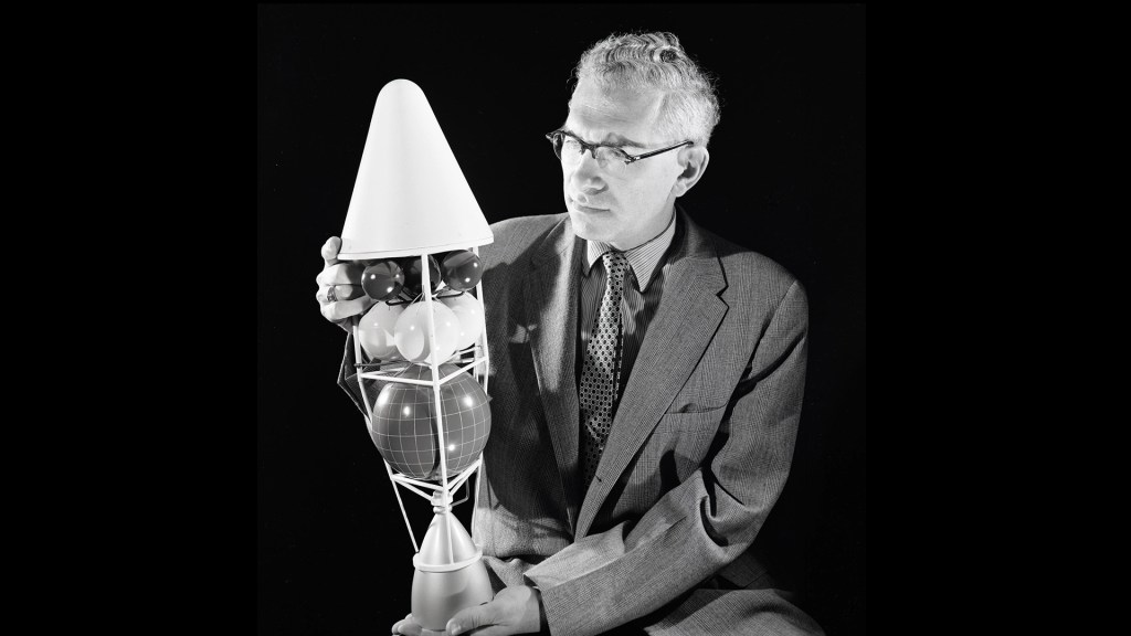 Man holding rocket model.