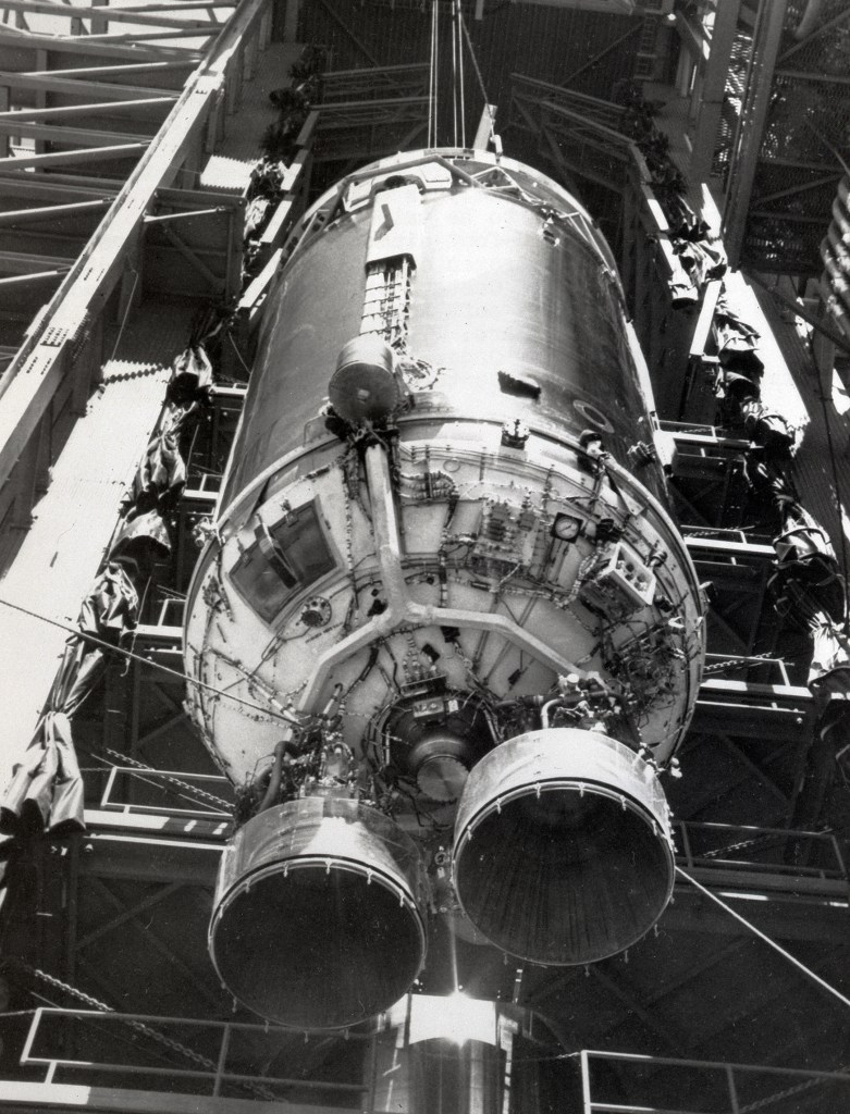 Centaur rocket hoisted into launch stand.