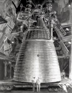 Large rocket engine with people in front.