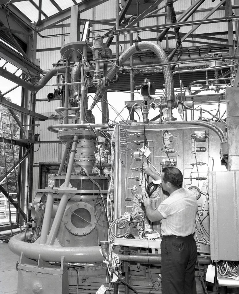Man working on RETF test stand