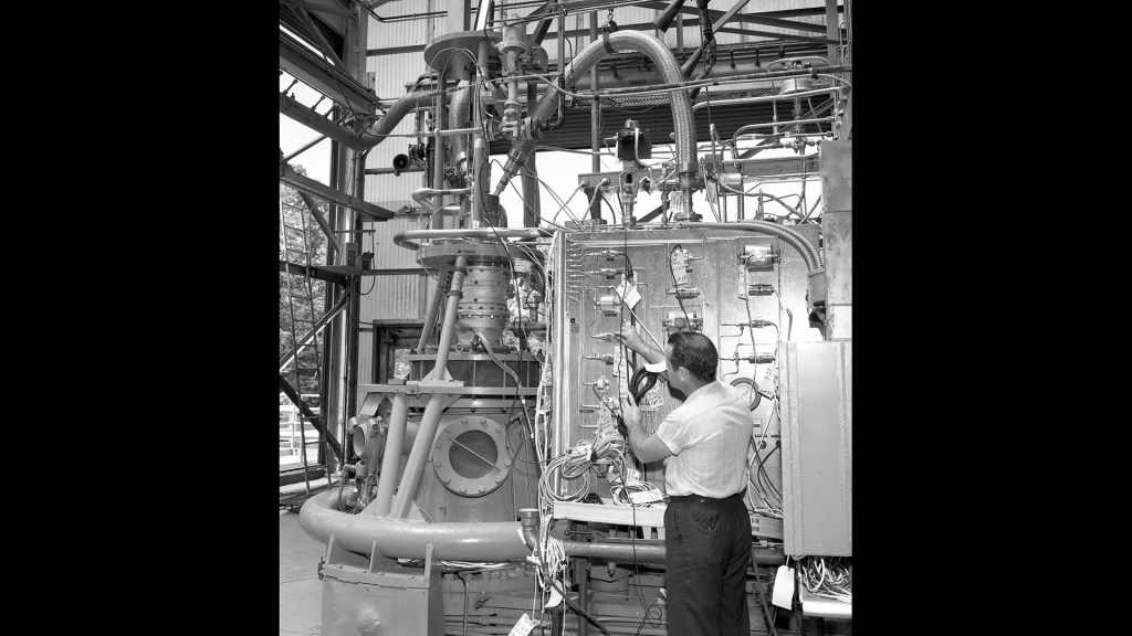 Man working on RETF test stand