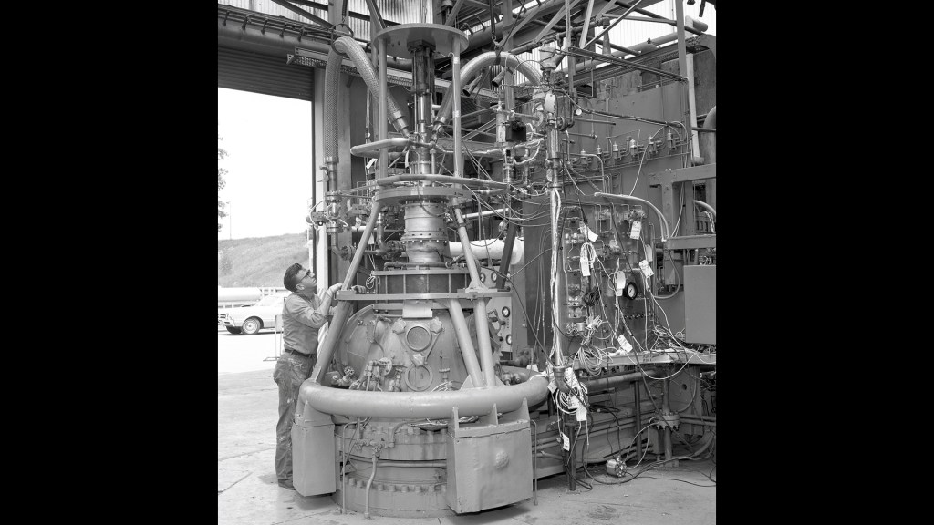 Man with engine in test stand