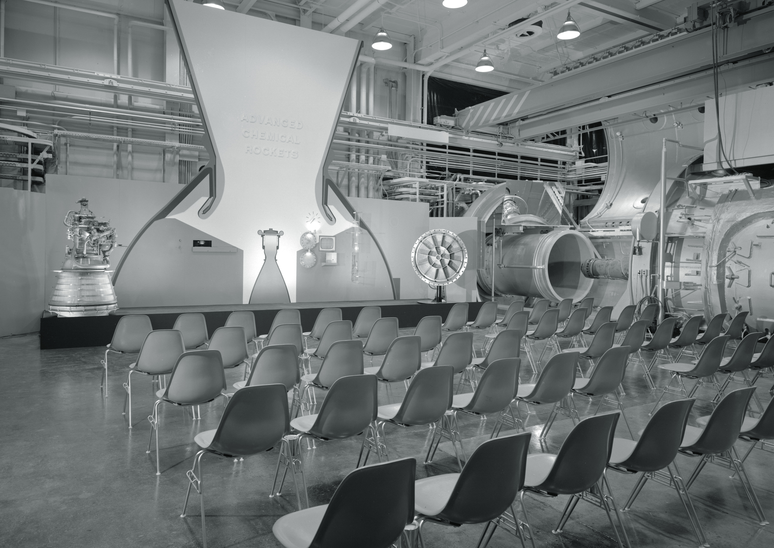 Chairs in front of exhibit.