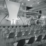 Chairs in front of exhibit.