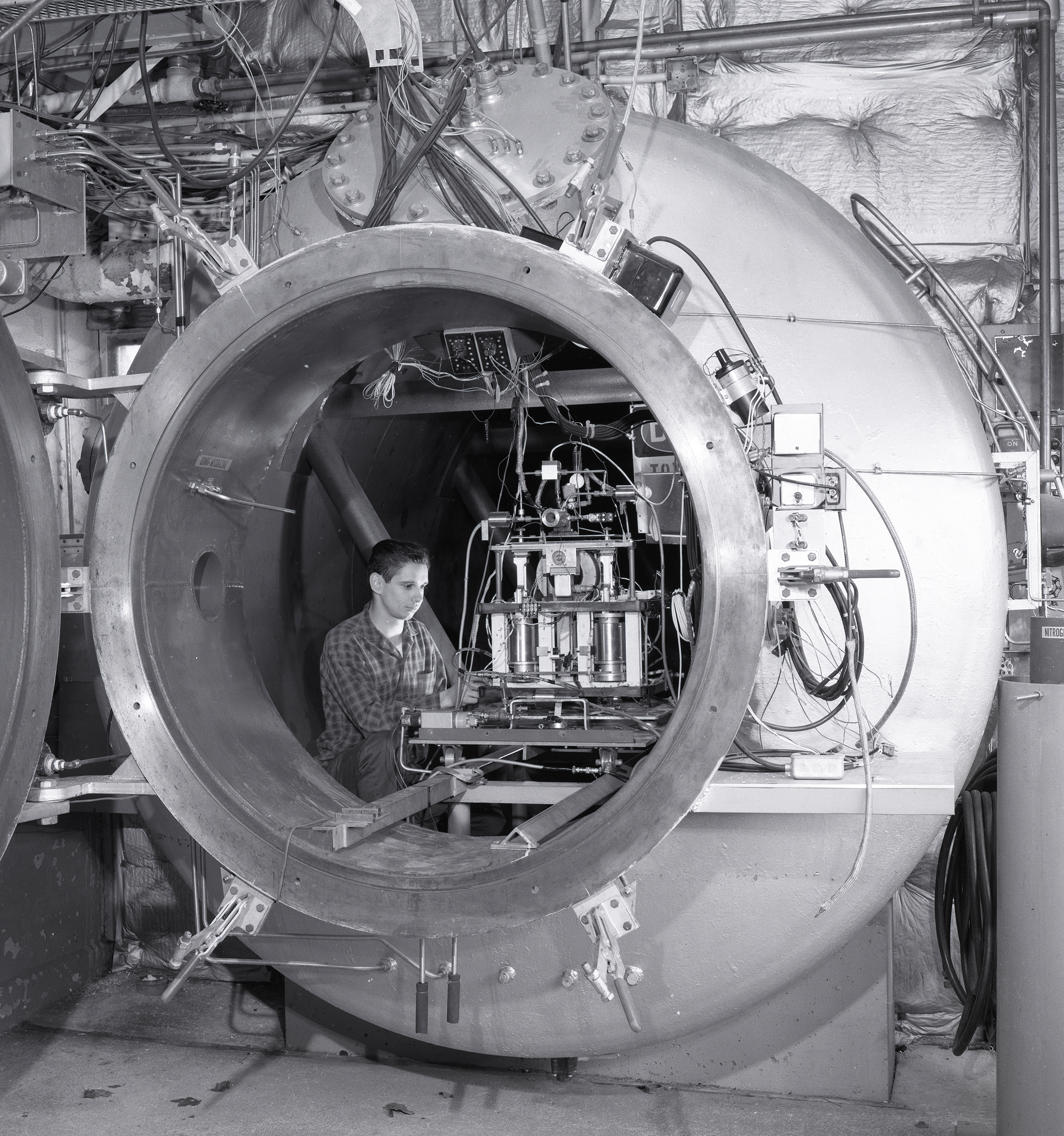 Man with equipment in tank.