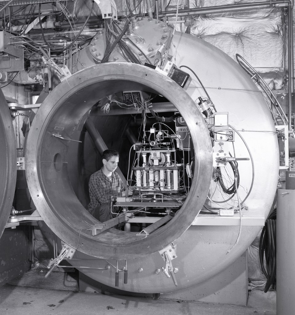 Man with equipment in tank.