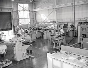 Men working with equipment in shop