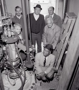 Men crowded in small test cell.