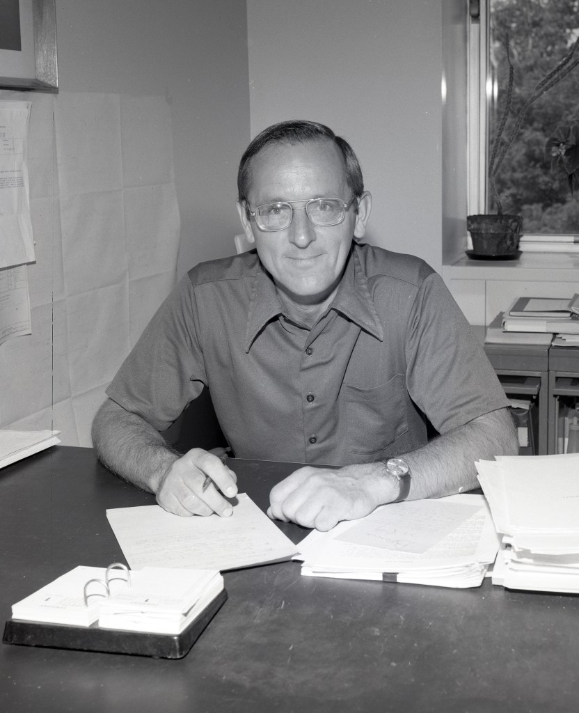 Man sitting at desk.