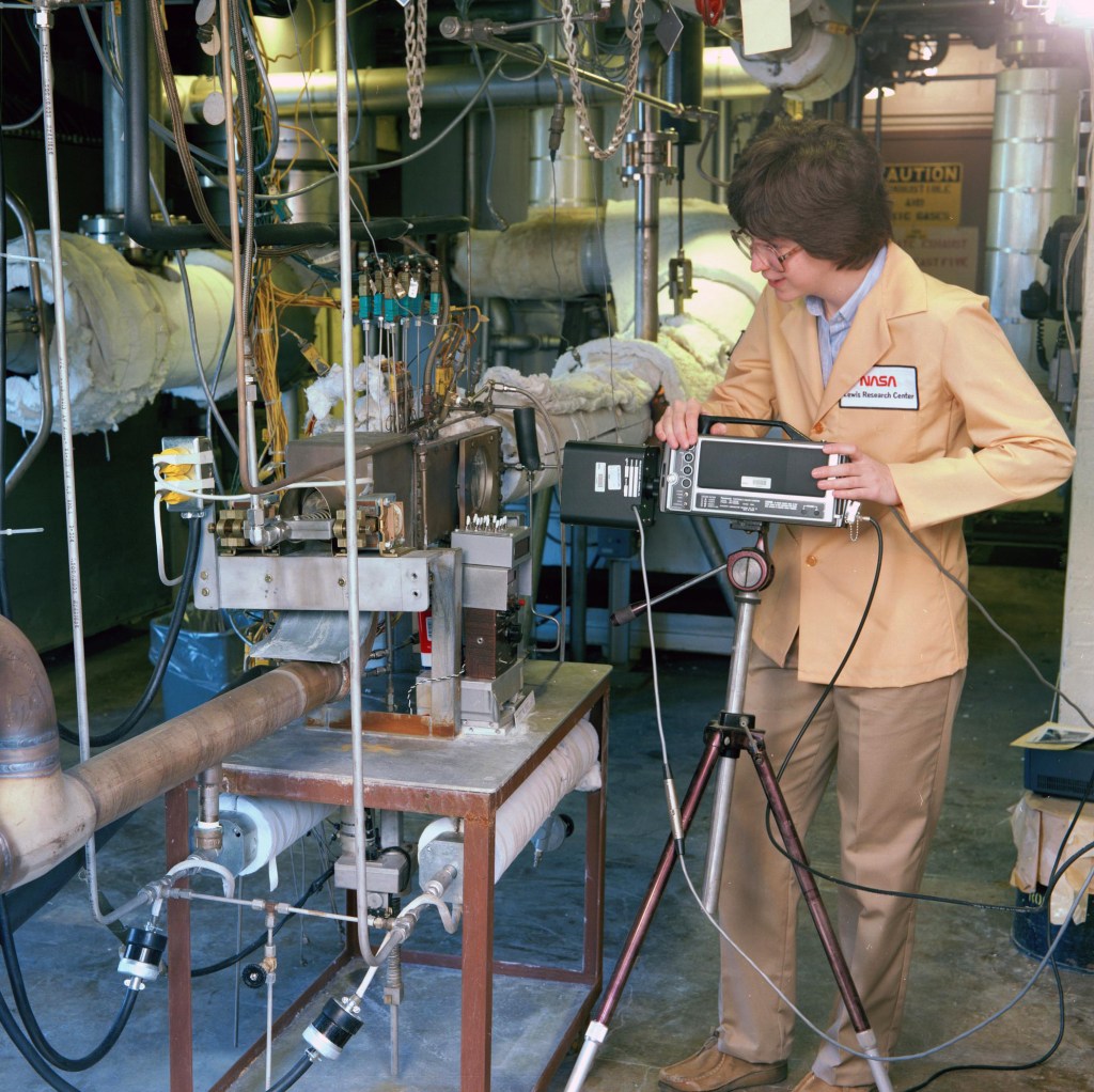 Woman working on test rig.