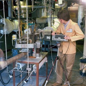 Woman working on test rig.