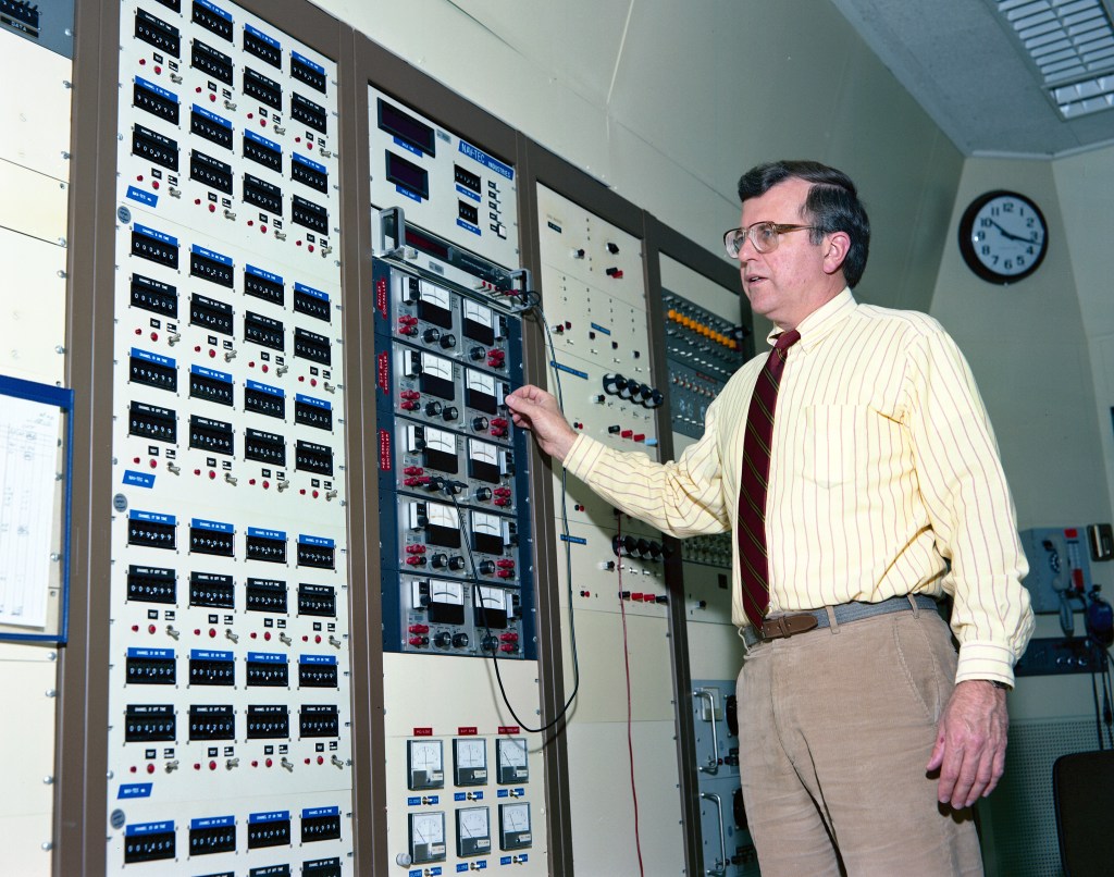 Engineer adjusting control panel