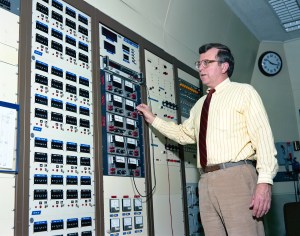 Engineer adjusting control panel