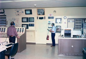RETF control room showing system schematic, television monitors, and control panels (1987).
