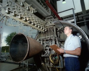 Engineer with horizontal test stand.