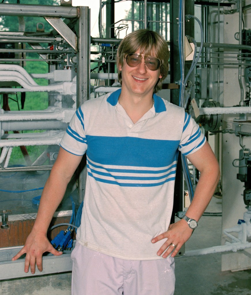 Man standing in front of equipment.