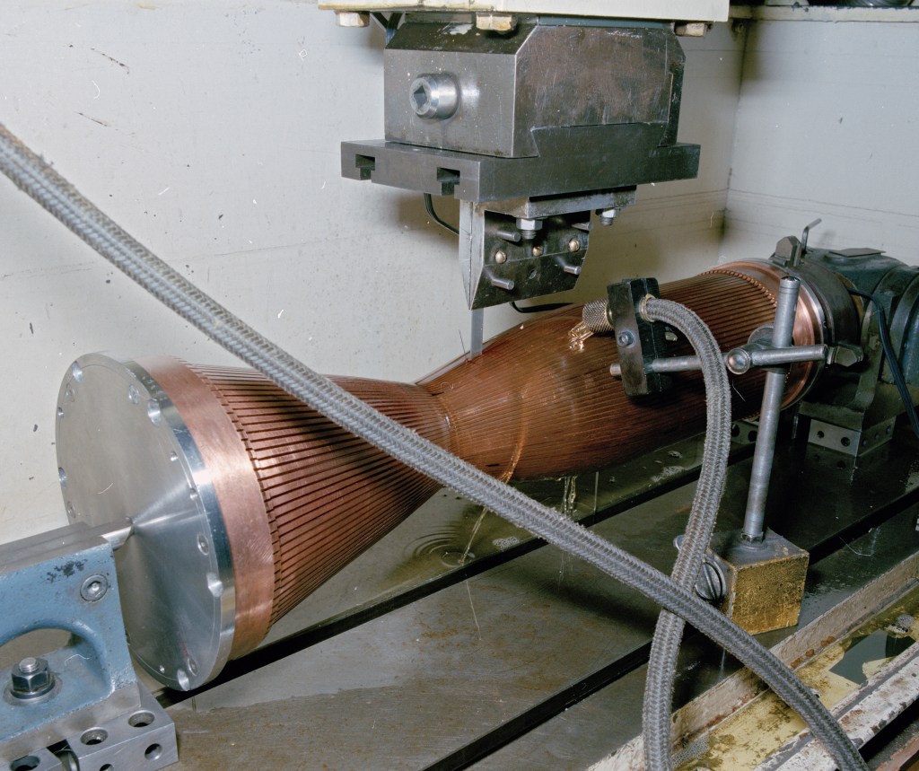 Thrust chamber on work bench.