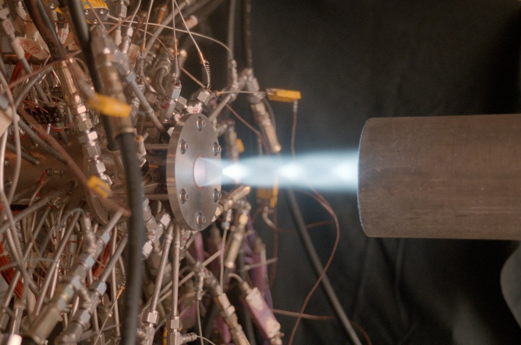 Thruster firing horizontally.