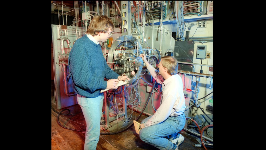 Two men with test rig.