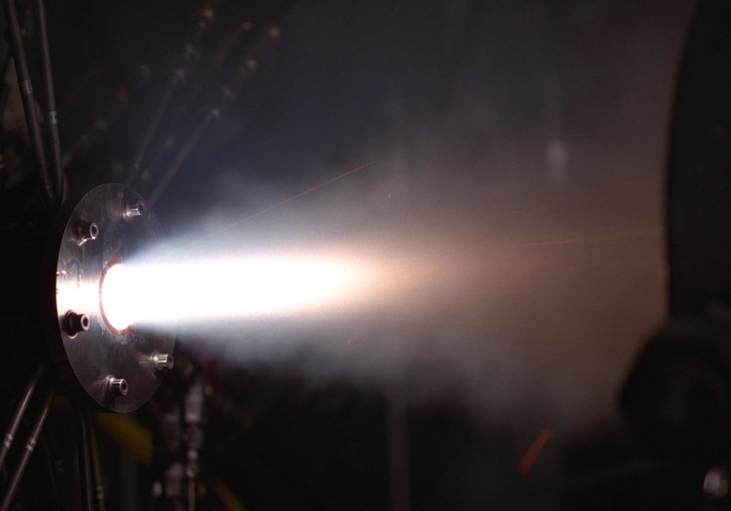 Thruster firing horizontally.