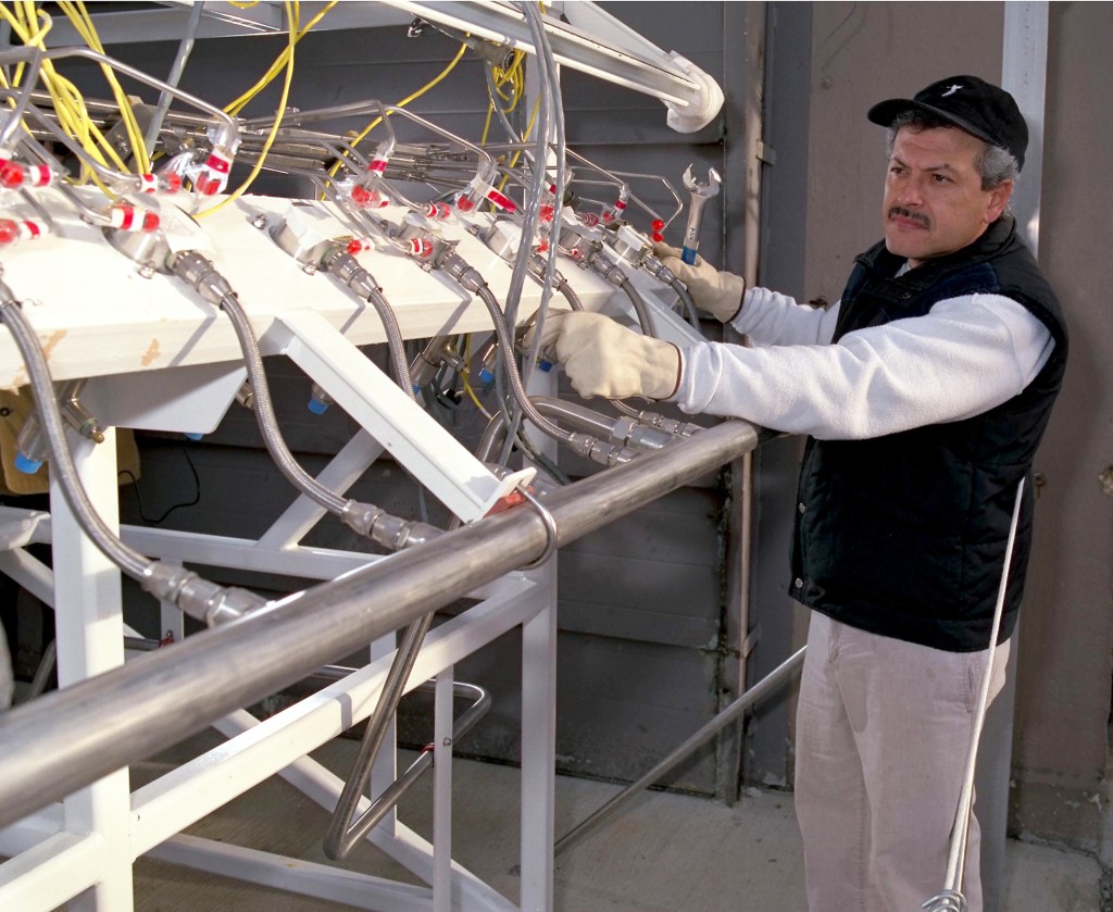 Man with test equipment.