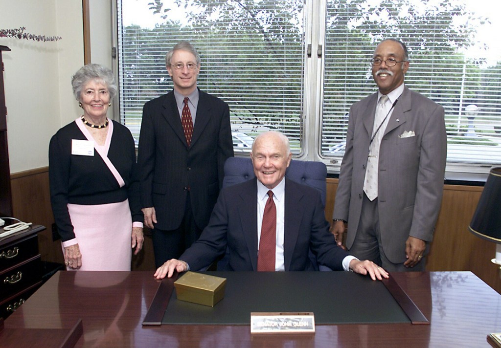 Group at desk in office.