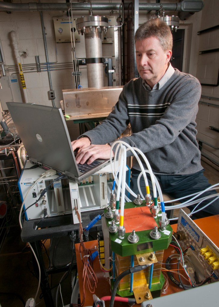 Man with test equipment.