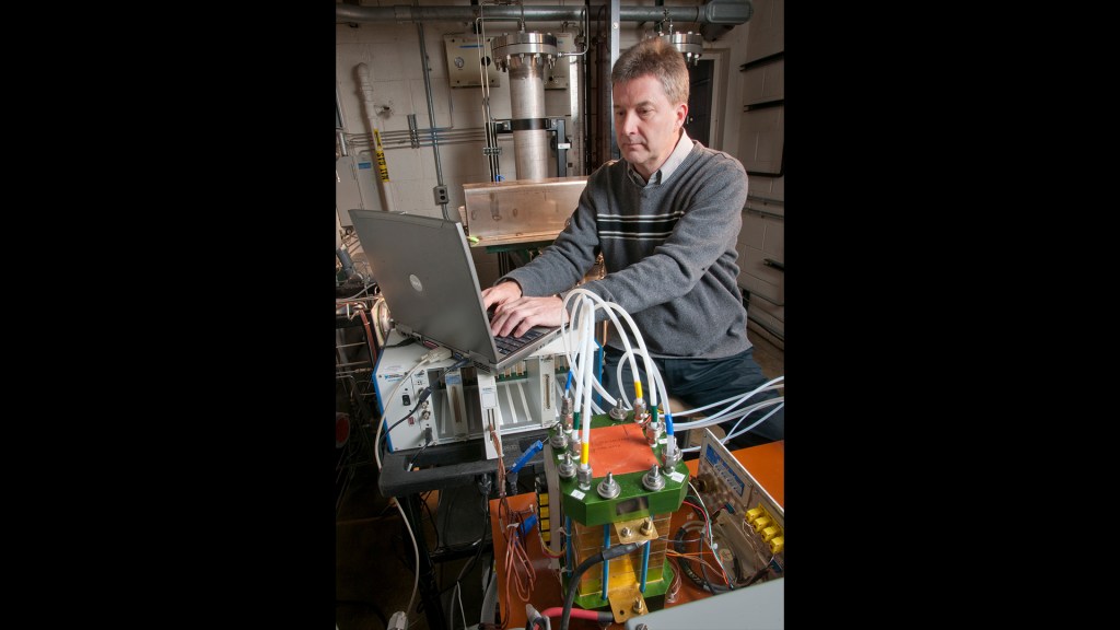 Man with test equipment.