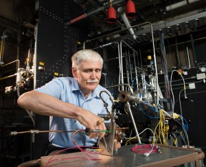 Man working on test equipment.