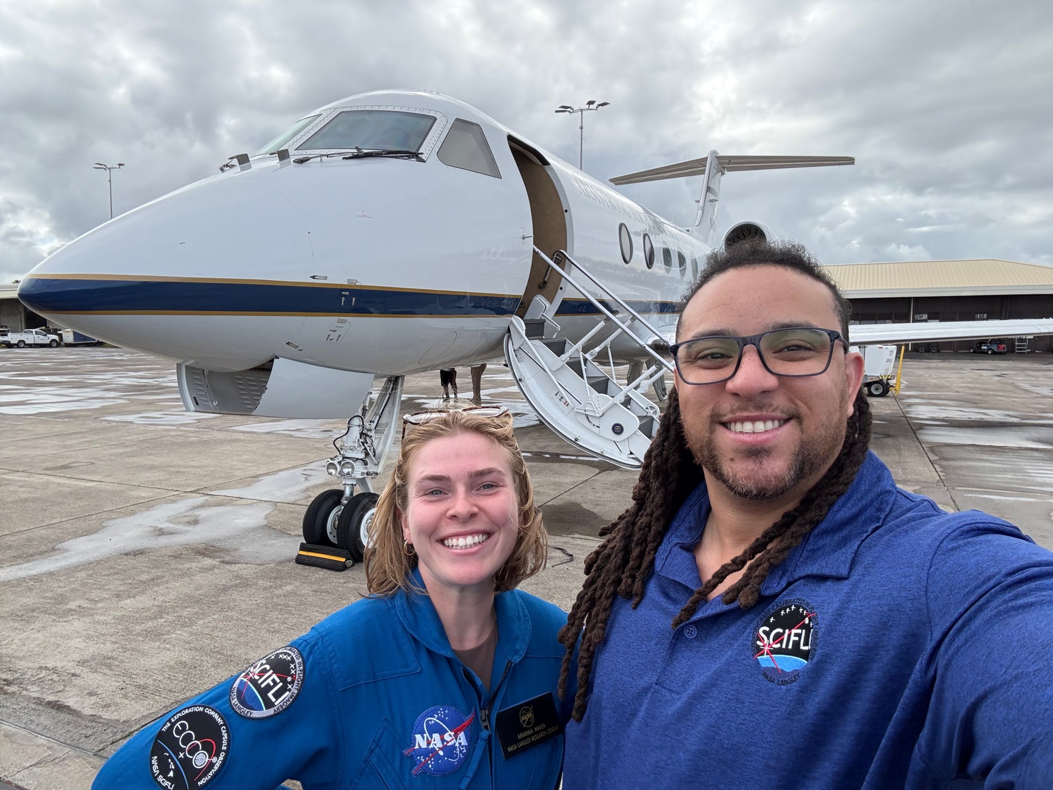 SCIFLI Asset Coordinator Ari Haven, left, and Principal Engineer Carey Scott in front of the G-III aircraft that will help the team image The Exploration Company’s Mission Possible demonstration capsule as it reenters Earth’s atmosphere.