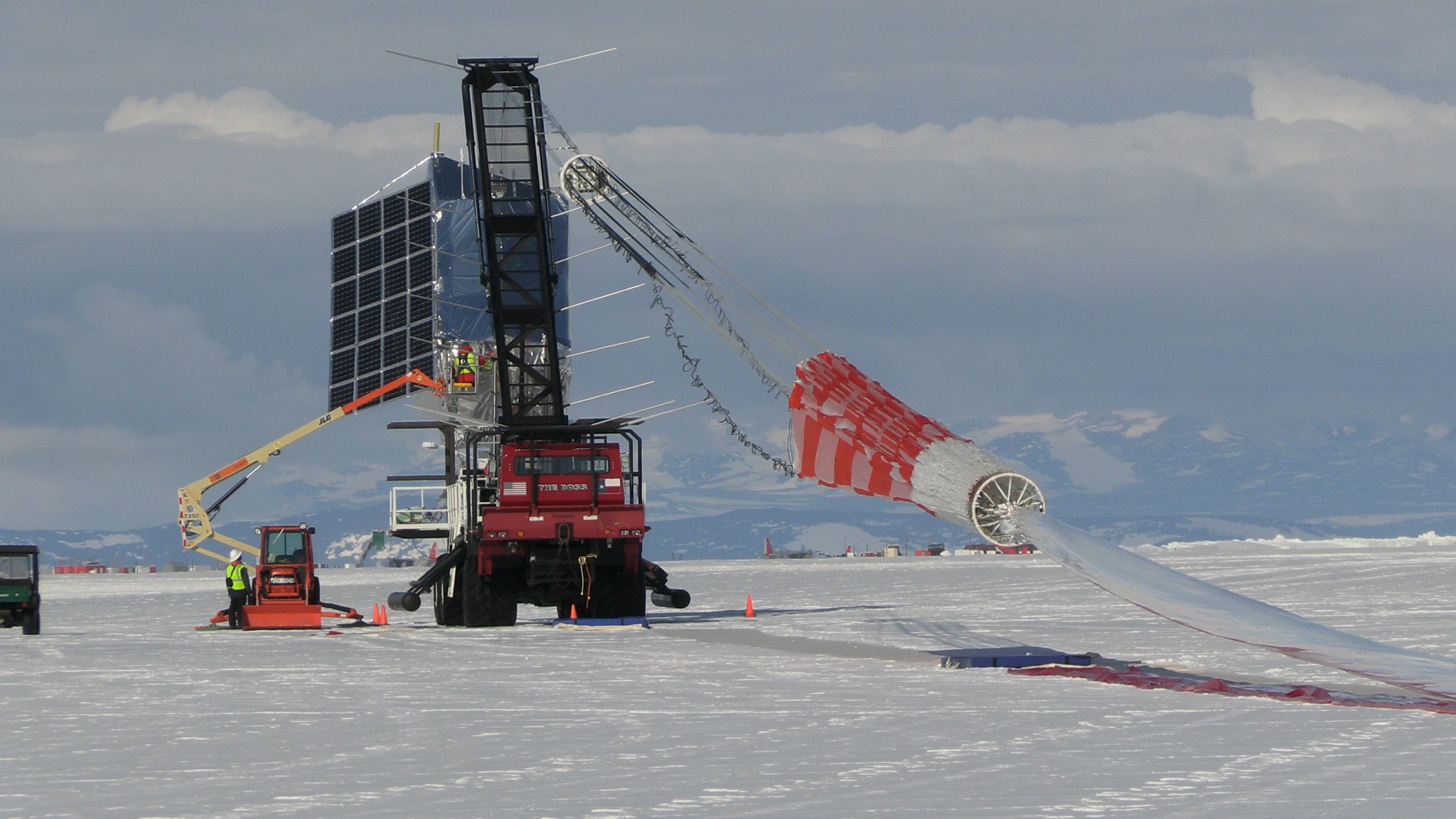 A payload attached to a launch vehicle is being prepared for launch in a Antarctica.
