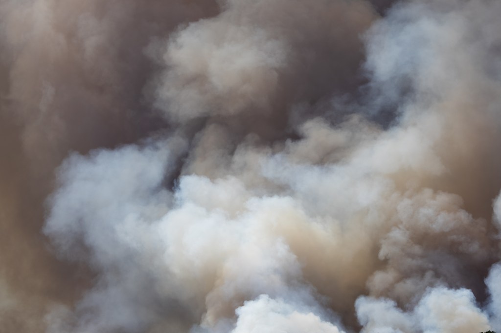 Smokey clouds vary in color from light gray and tan to almost black.