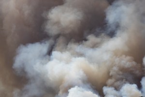 Smokey clouds vary in color from light gray and tan to almost black.