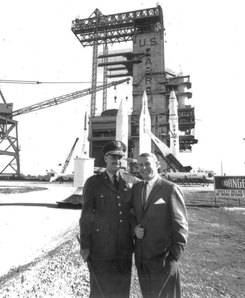 von Braun and Medaris standing in front of launch pad.