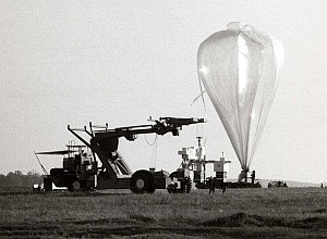 Black and white image of balloon being prepped for launch.