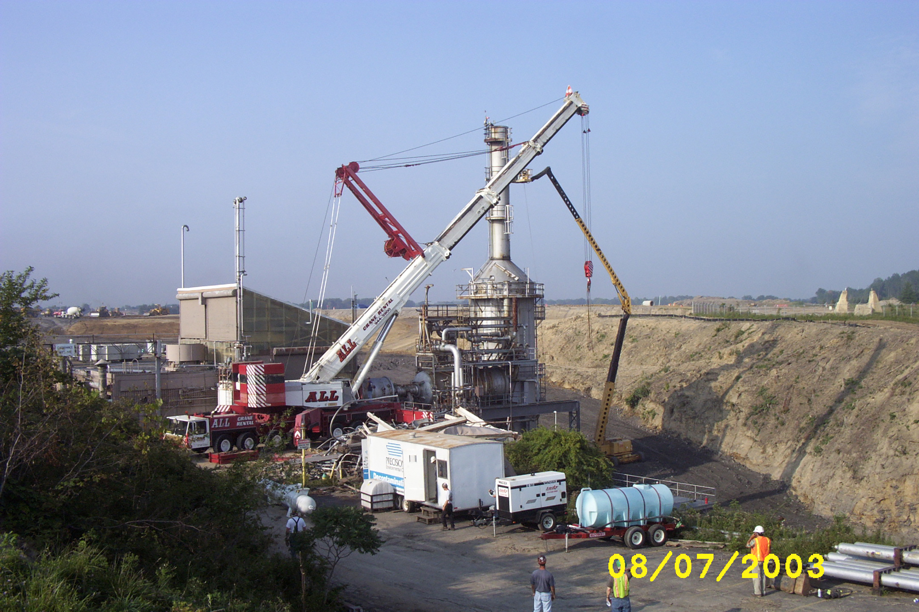 Cranes dismantle the RETF in August 2003.