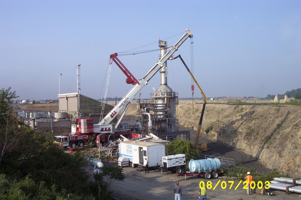 Cranes dismantle the RETF in August 2003.