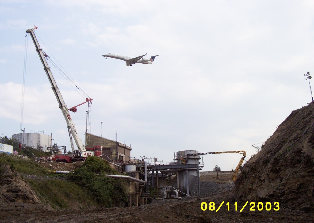 Cranes dismantle the RETF in August 2003.