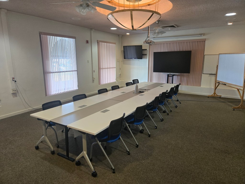The Mezzanine meeting room shown in it's default configuration of a boardroom style table layout with seating for up to 12 attendees.