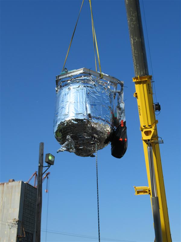 The tank for NASA’s two-stage cooling tests is lowered into a vacuum chamber in Test Stand 300 at NASA’s Marshall Space Flight Center in Huntsville, Alabama.