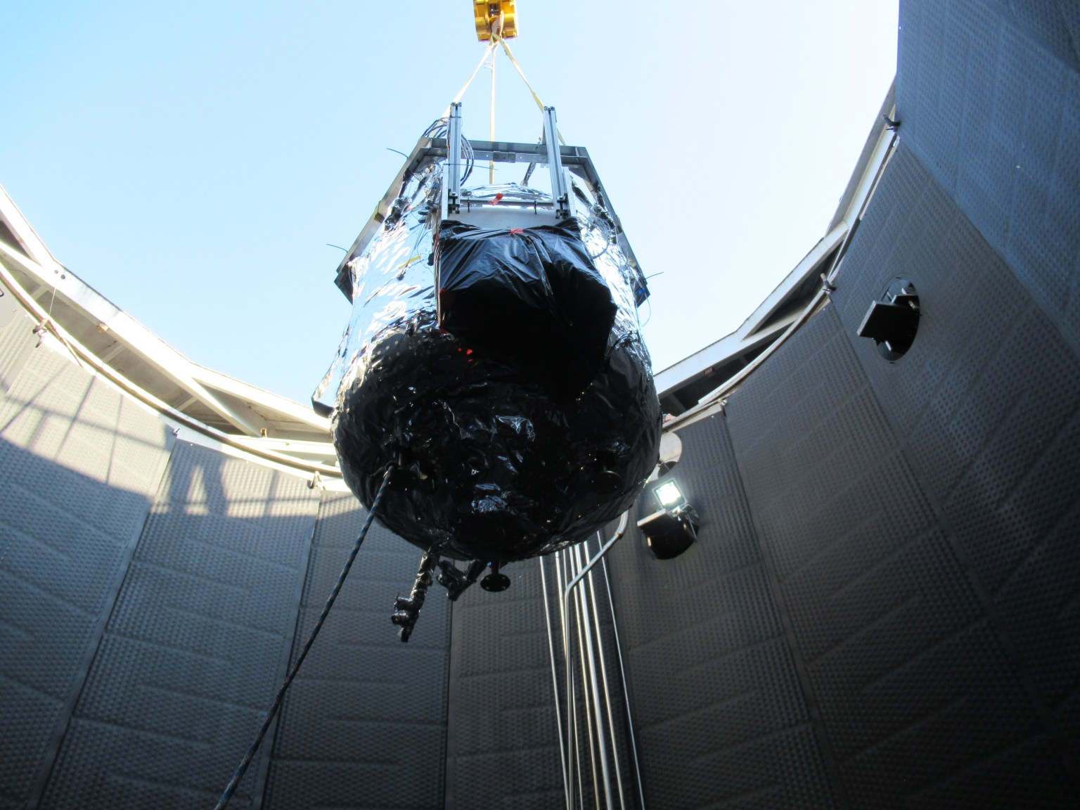 The tank for NASA’s two-stage cooling tests is lowered into a vacuum chamber in Test Stand 300 at NASA’s Marshall Space Flight Center in Huntsville, Alabama.