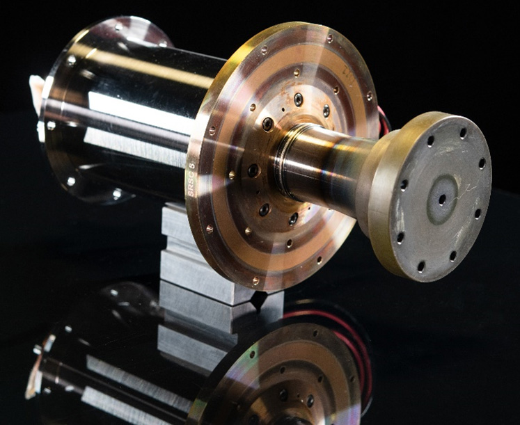 Cylindrical 60-watt Stirling convertor with flanged ends and polished housing, designed for robust space power generation.