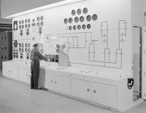 Man at large control panel.