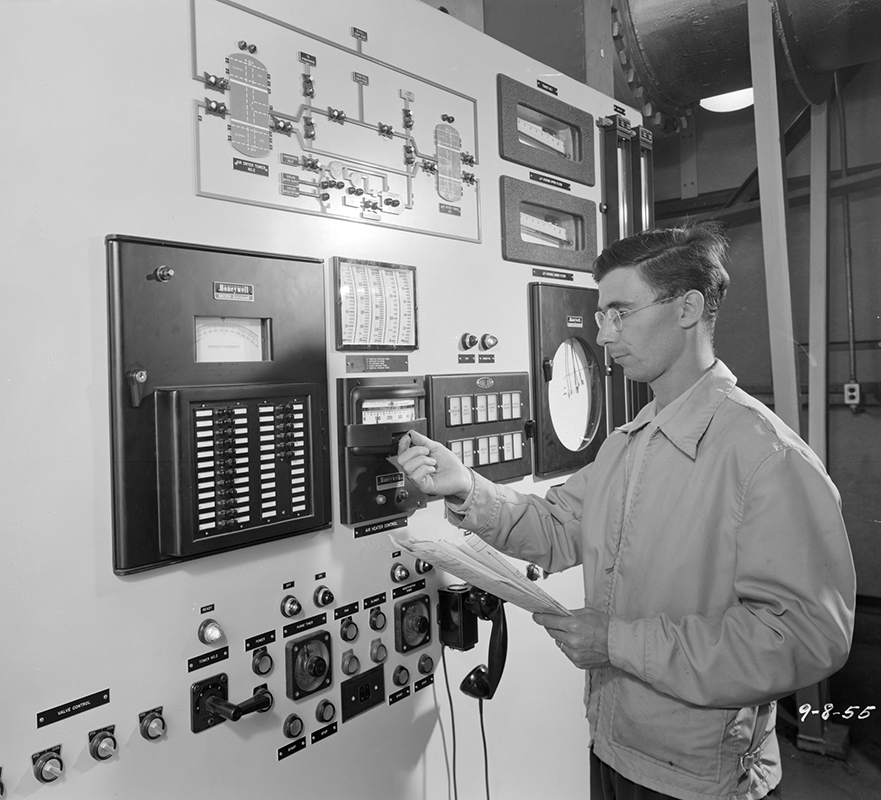 Man looking at control panel.