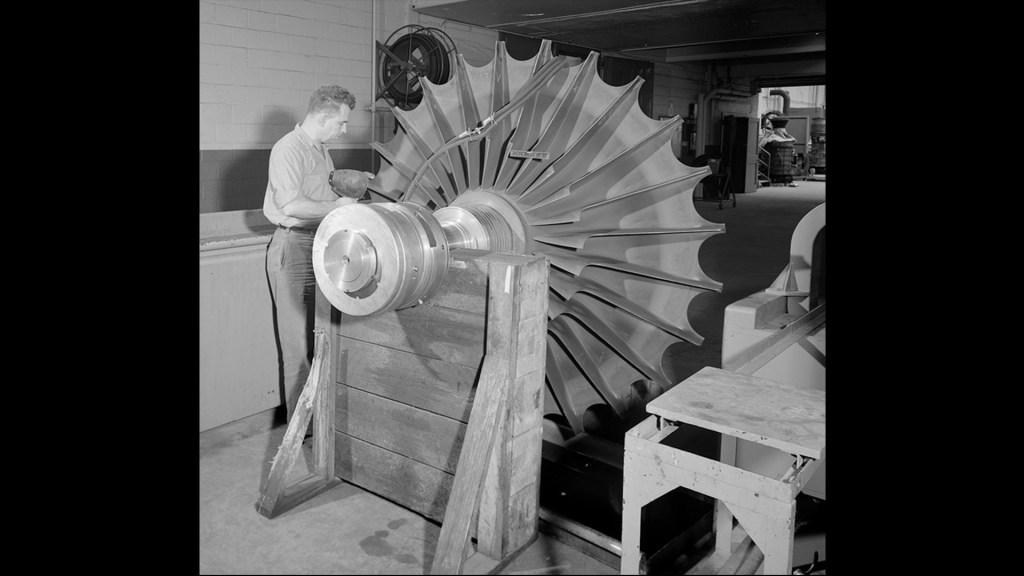Man working on equipment.