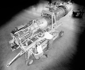 View from above of mechanic working on engine.